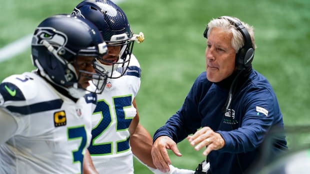 Travis Homer Russell Wilson